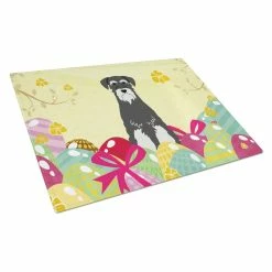 Caroline&apos;s Treasures BB6033LCB Easter Eggs Standard Schnauzer Salt & Pepper Glass Cutting Board - Large
